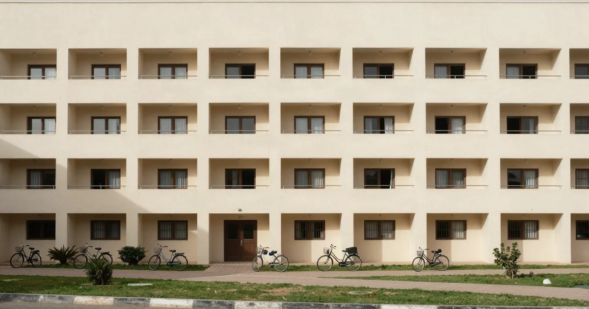 Student residence in Rabat, repeated window openings, landscaped forecourt and parked bicycles