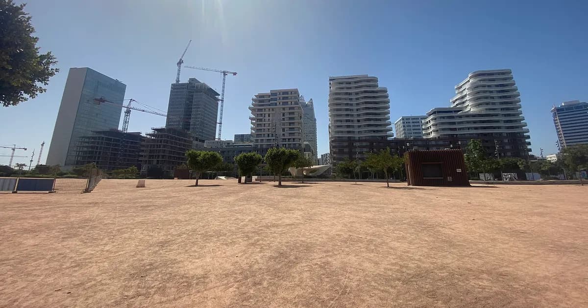 New towers and cranes in Casablanca with an undeveloped plot in the foreground